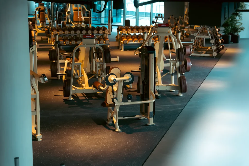 Panatta strength machines in a cream and brown finish across the ARKHE Dubai Marina training floor.