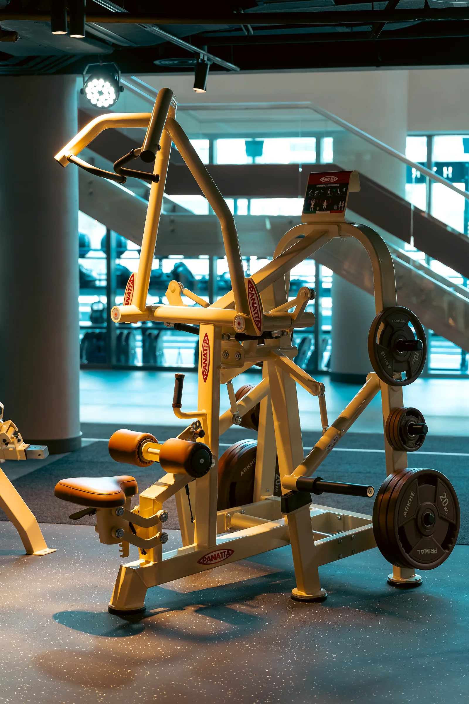 Multi-station strength machine in a modern gym interior