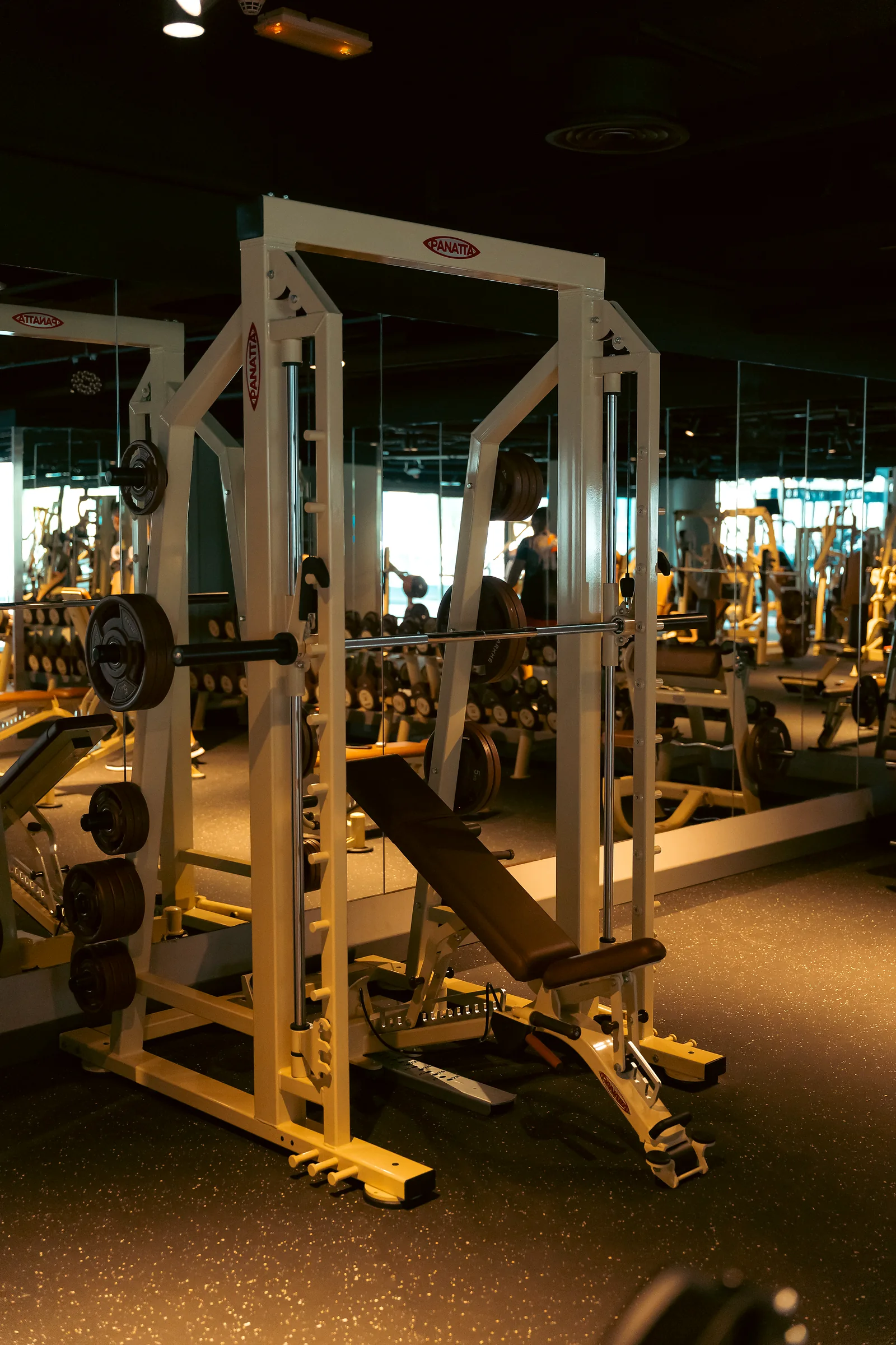 Multi-station strength machine in a modern gym interior