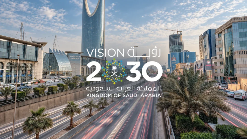 Saudi Vision 2030 logo over a Riyadh street at dusk, with Kingdom Centre and car light trails